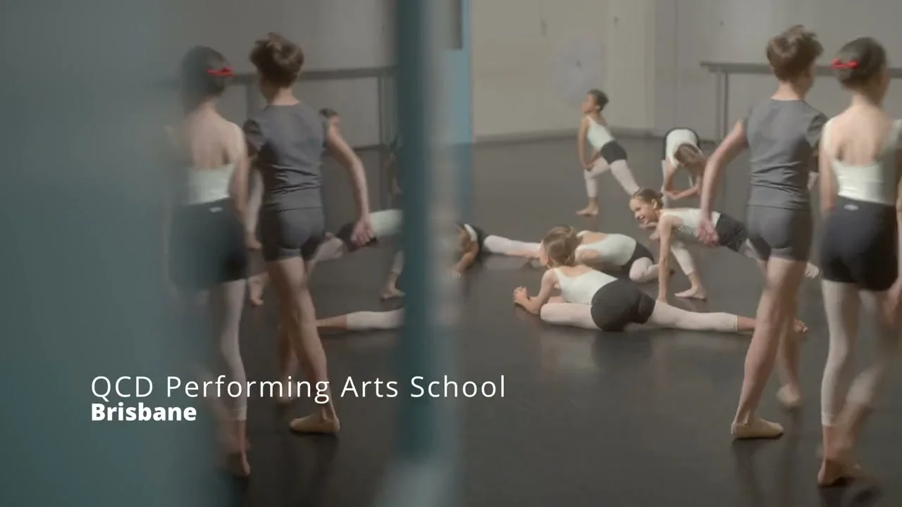 Young dancers stretching and rehearsing in a studio